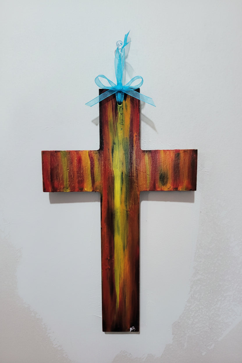 Hand-painted wooden cross with warm abstract blend of red, yellow, gold tones and blue ribbon hanger