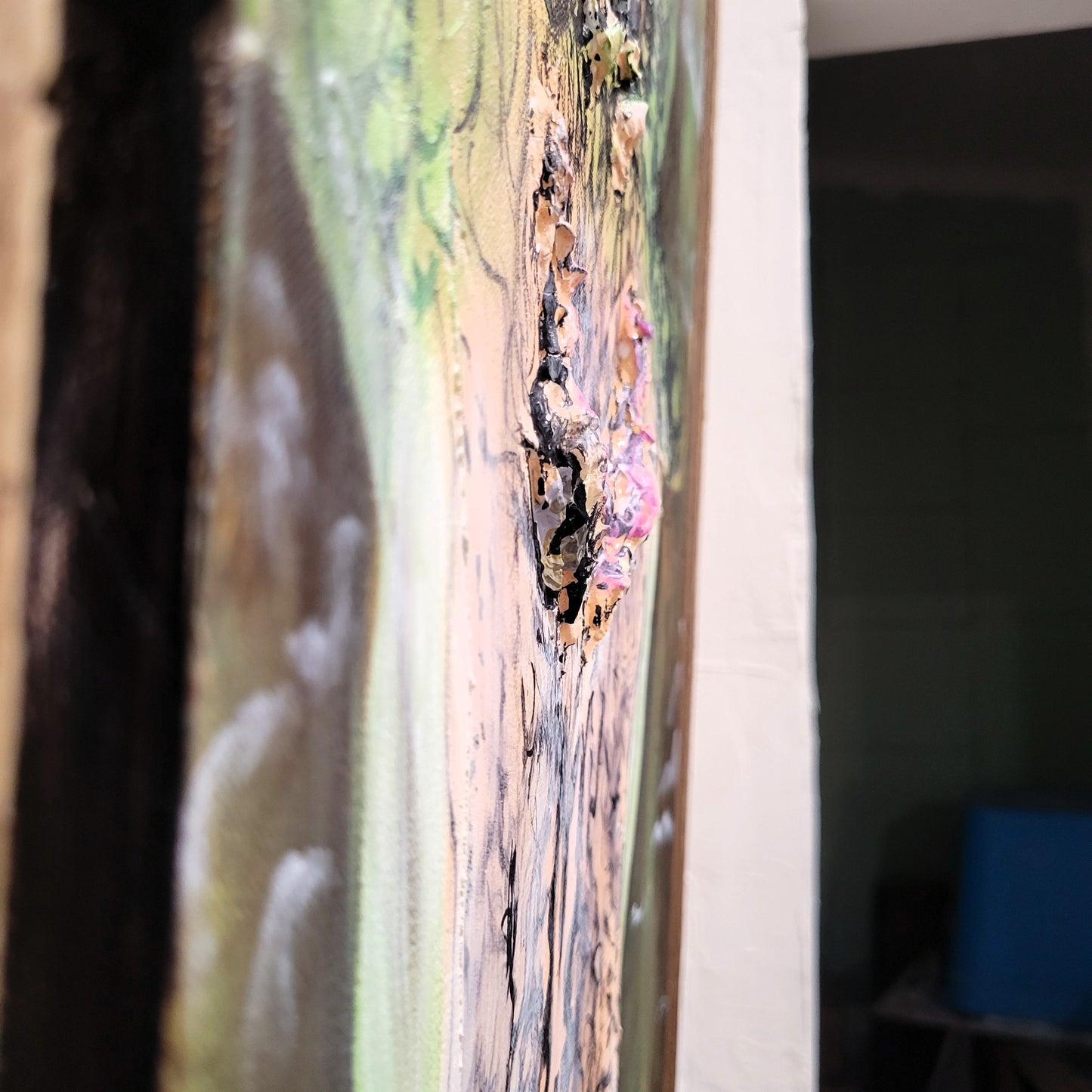 Side detail of 3D sculpted eyes on acrylic alligator painting