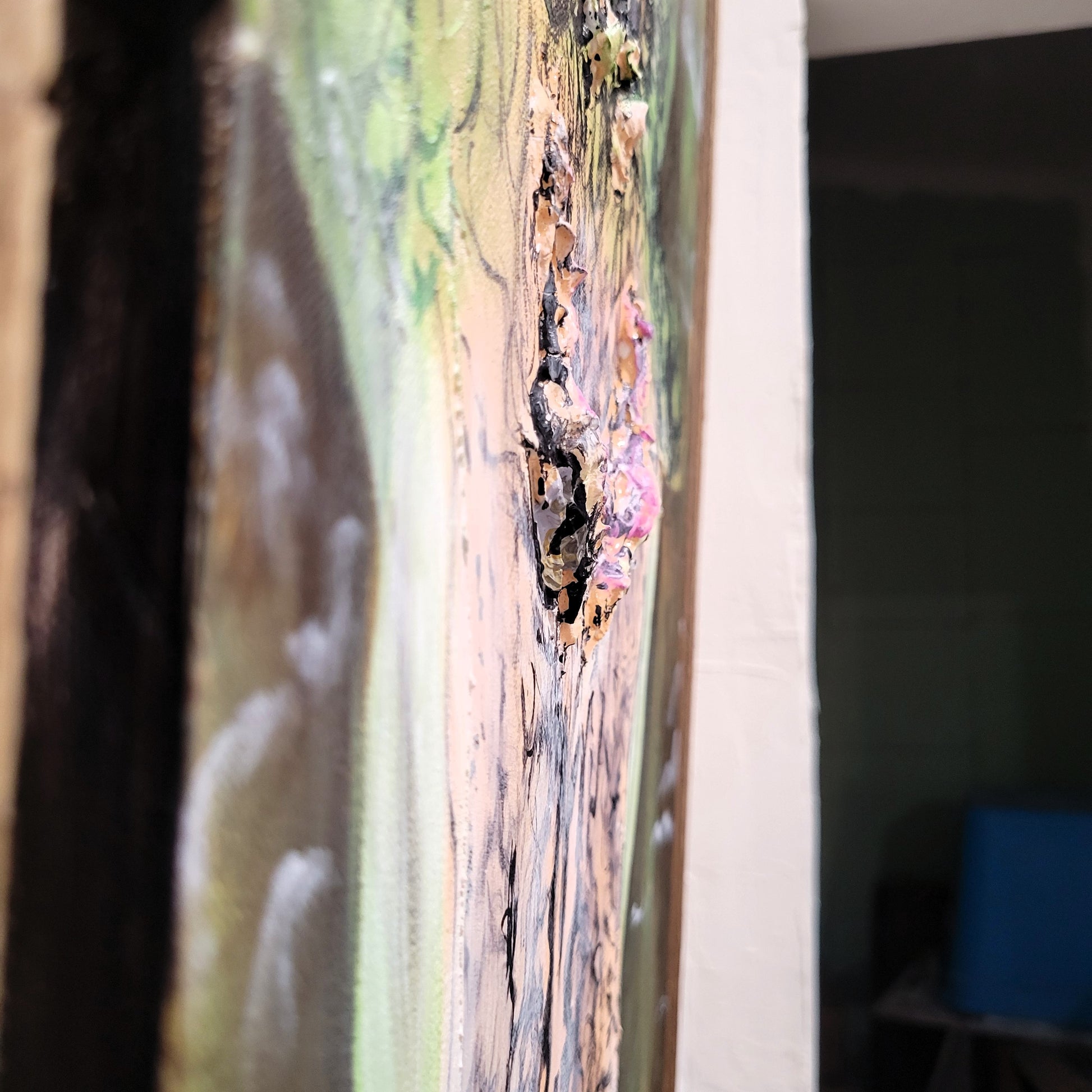 Side detail of 3D sculpted eyes on acrylic alligator painting