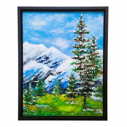 Original palette knife landscape painting of snowy trees, blue mountains, and winter sky in black floater frame by Amy Bridges