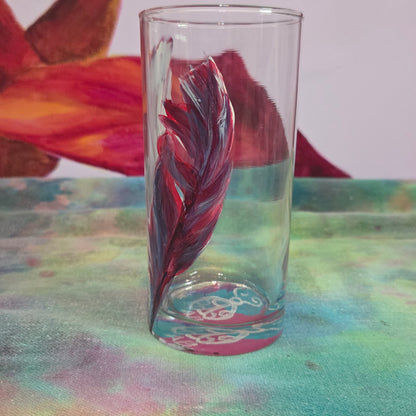 Hand-painted 16 oz tall tumbler with two flowing cardinal feathers in deep red, purple, cobalt blue, and white
