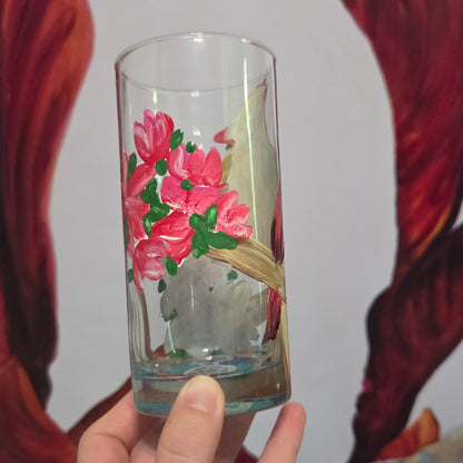Hand-painted 16 oz tall tumbler with a female cardinal perched on a flowering branch surrounded by red, white, blue, and pink blossoms