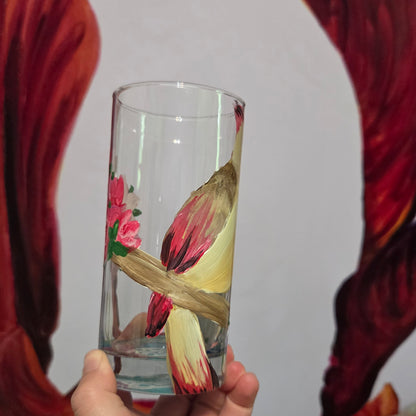 Hand-painted 16 oz tall tumbler with a female cardinal perched on a flowering branch surrounded by red, white, blue, and pink blossoms