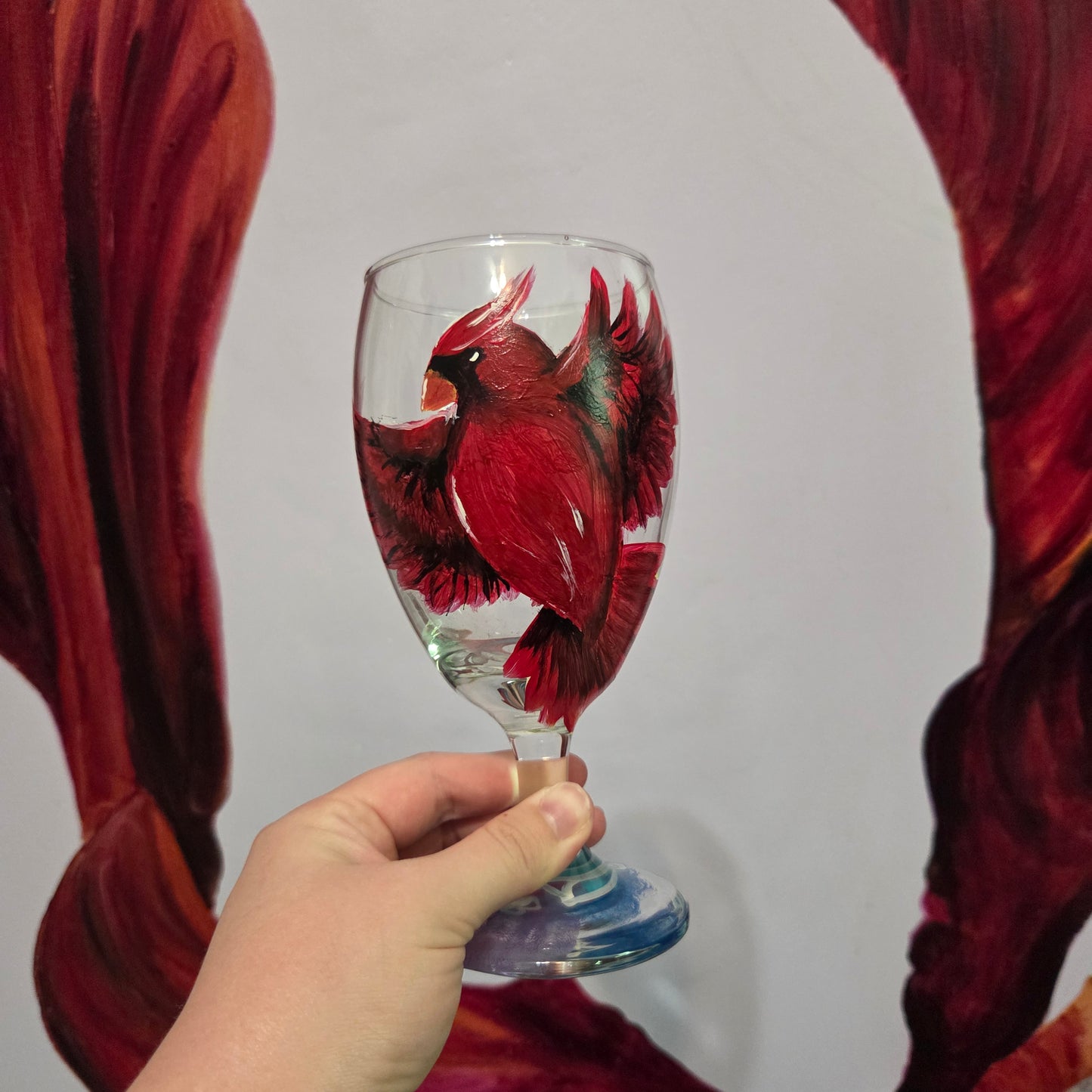Hand-painted 16 oz goblet with a bold red cardinal facing forward and spreading his wings