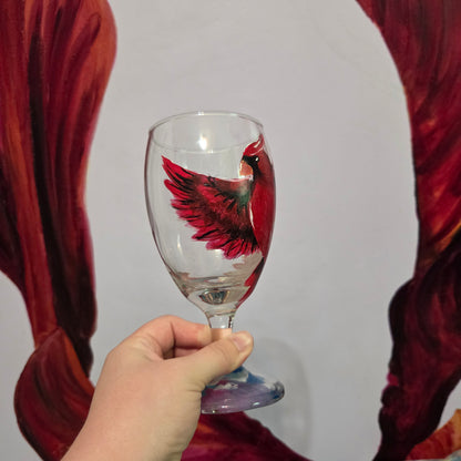 Hand-painted 16 oz goblet with a bold red cardinal facing forward and spreading his wings