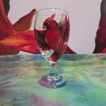 Hand-painted 16 oz goblet with a bold red cardinal facing forward and spreading his wings