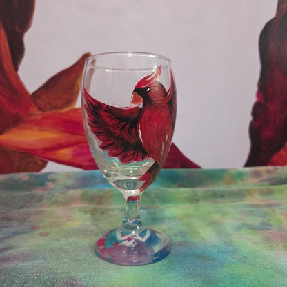 Hand-painted 16 oz goblet with a bold red cardinal facing forward and spreading his wings