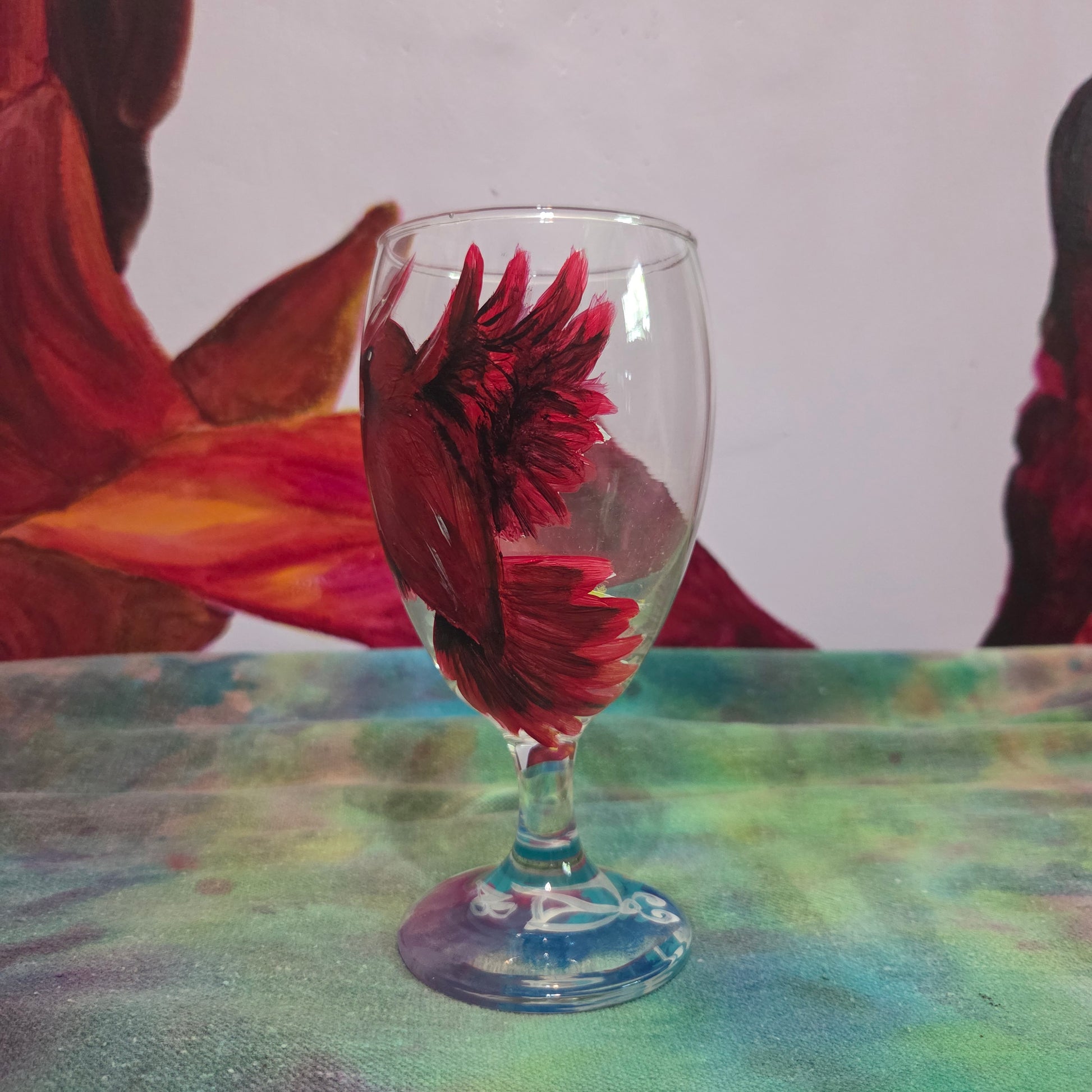 Hand-painted 16 oz goblet with a bold red cardinal facing forward and spreading his wings