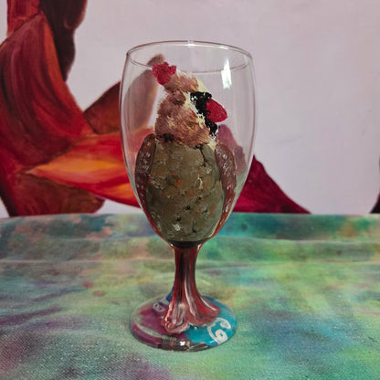 Hand-painted 16 oz goblet with a fluffy female cardinal perched on the bowl and tail feathers extending down the stem