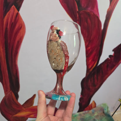Hand-painted 16 oz goblet with a fluffy female cardinal perched on the bowl and tail feathers extending down the stem