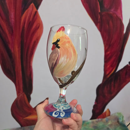 Hand-painted 16 oz goblet with a female cardinal looking over her shoulder, perched on a branch with peach-pink coloring