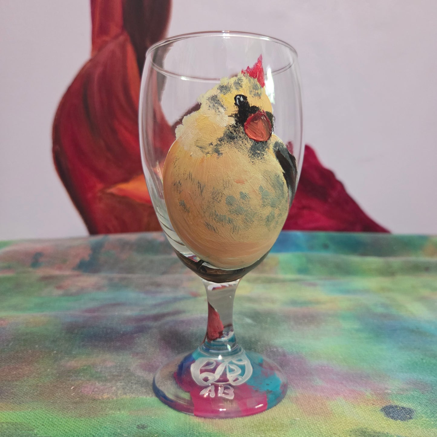 Hand-painted 16 oz goblet with a fluffy cream-colored female cardinal with pink accents and wings tucked behind her back
