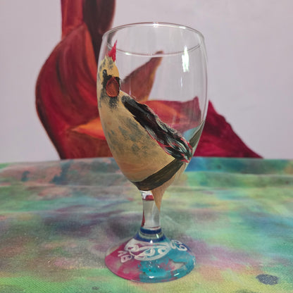 Hand-painted 16 oz goblet with a fluffy cream-colored female cardinal with pink accents and wings tucked behind her back