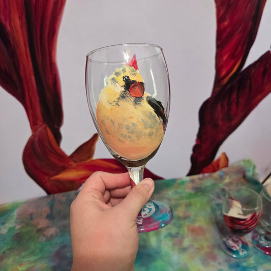 Hand-painted 16 oz goblet with a fluffy cream-colored female cardinal with pink accents and wings tucked behind her back