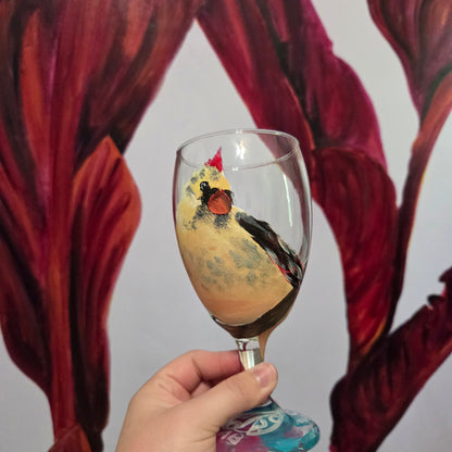 Hand-painted 16 oz goblet with a fluffy cream-colored female cardinal with pink accents and wings tucked behind her back