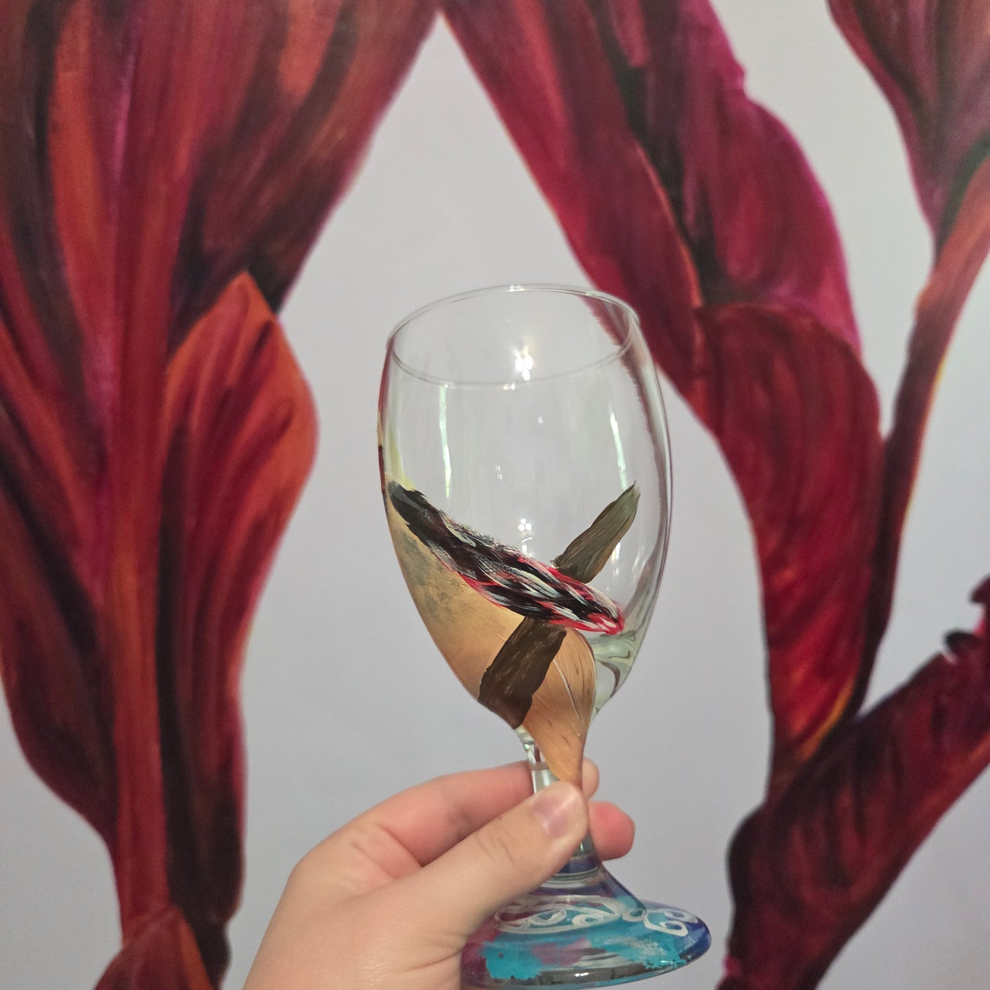Hand-painted 16 oz goblet with a fluffy cream-colored female cardinal with pink accents and wings tucked behind her back