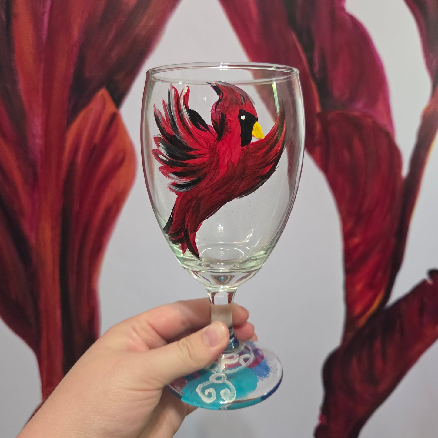 Hand-painted 16 oz goblet featuring a complete red cardinal in flight with bold black and white details