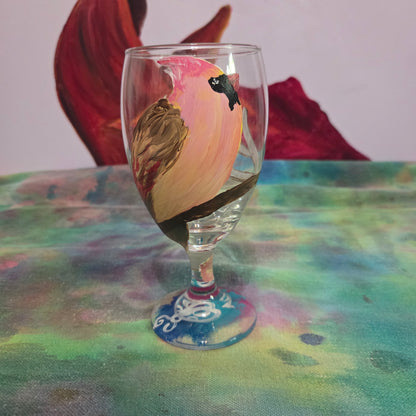 Hand-painted 16 oz glass with a pink-toned female cardinal perched on a branch and looking upward