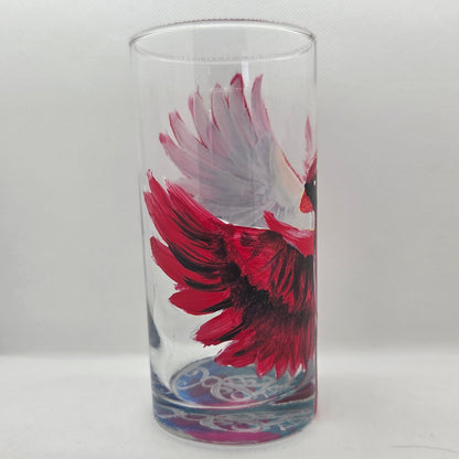Hand-painted 16 oz tumbler featuring a bold red cardinal facing forward with wings spread wide