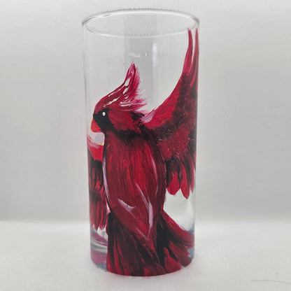 Hand-painted 16 oz tumbler featuring a bold red cardinal facing forward with wings spread wide