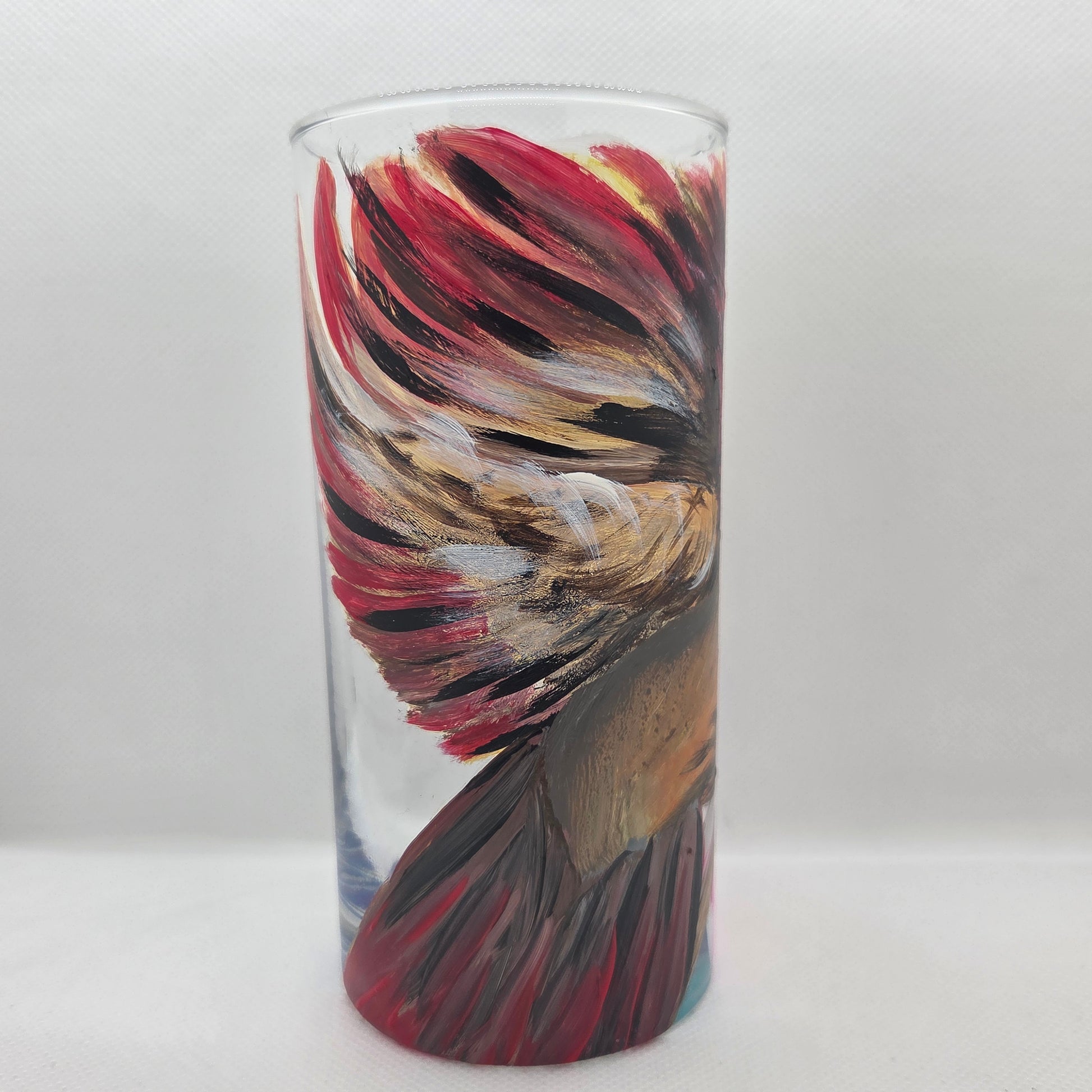 Hand-painted 16 oz tall tumbler with a female cardinal spreading her wings among large pink blossoms