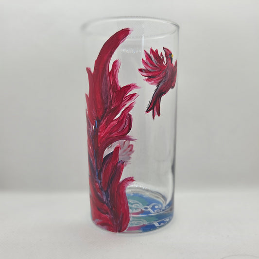 Hand-painted 16 oz tall tumbler with two flying cardinals surrounding a flowing feather