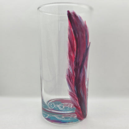 Hand-painted 16 oz tall tumbler with two flowing cardinal feathers in deep red, purple, cobalt blue, and white