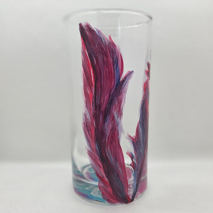 Hand-painted 16 oz tall tumbler with two flowing cardinal feathers in deep red, purple, cobalt blue, and white