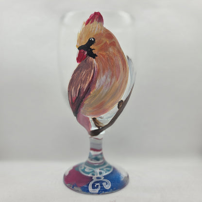 Hand-painted 16 oz goblet with a female cardinal looking over her shoulder, perched on a branch with peach-pink coloring