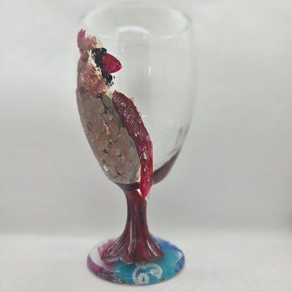 Hand-painted 16 oz goblet with a fluffy female cardinal perched on the bowl and tail feathers extending down the stem