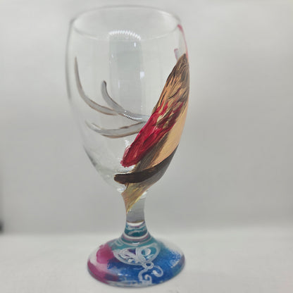 Hand-painted 16 oz glass with a pink-toned female cardinal perched on a branch and looking upward