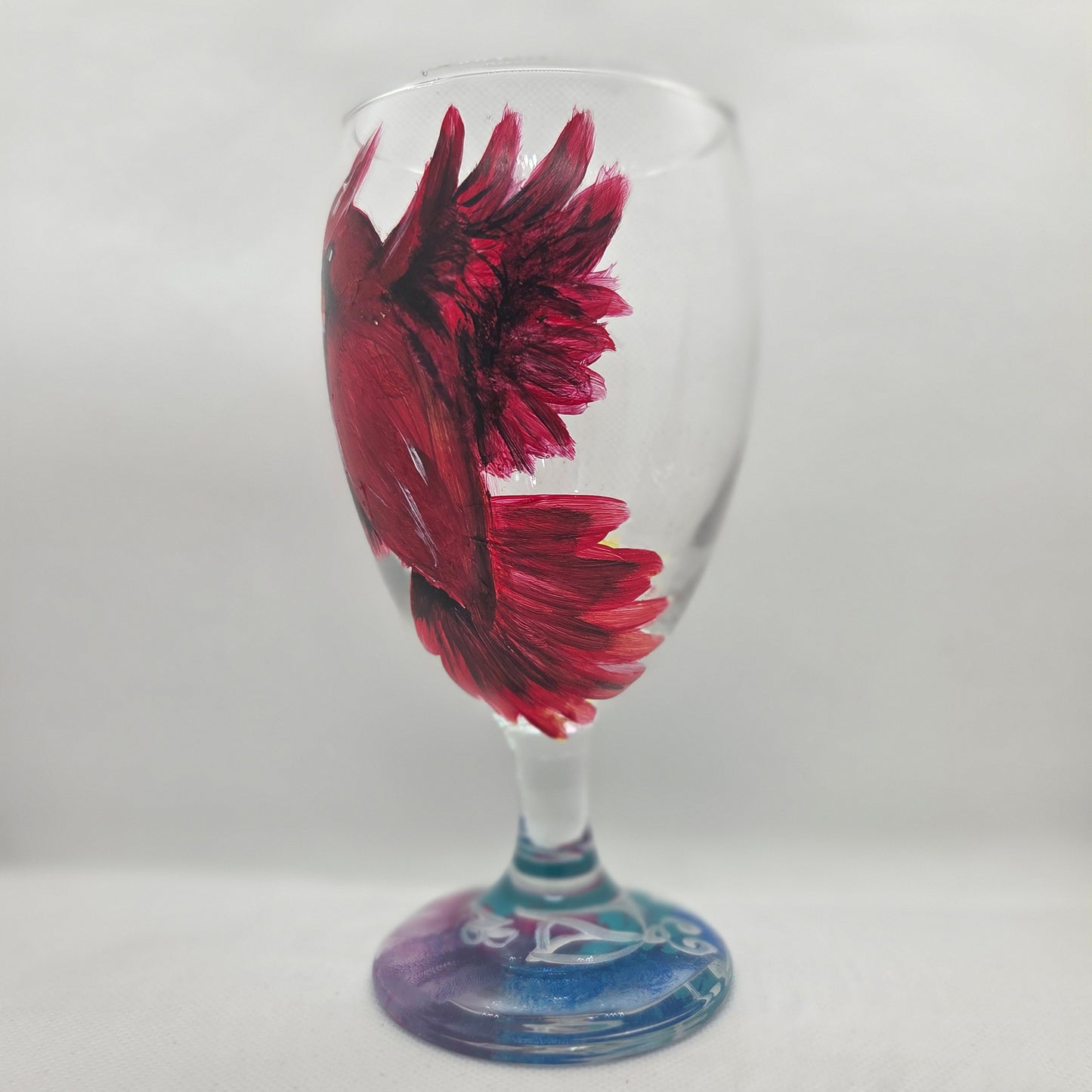 Hand-painted 16 oz goblet with a bold red cardinal facing forward and spreading his wings