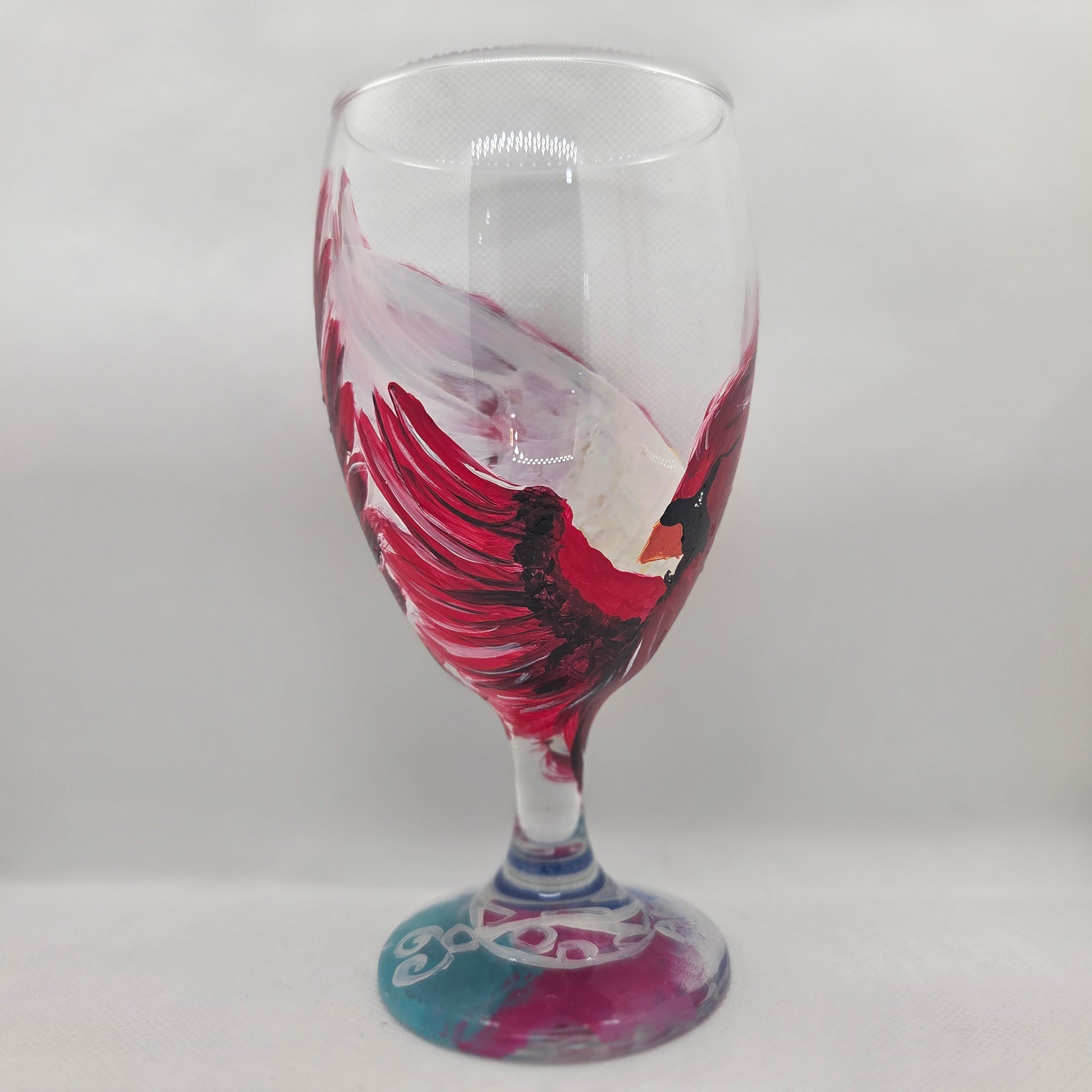 Hand-painted 16 oz goblet with a dramatic red male cardinal and enormous wings spreading up and around the glass