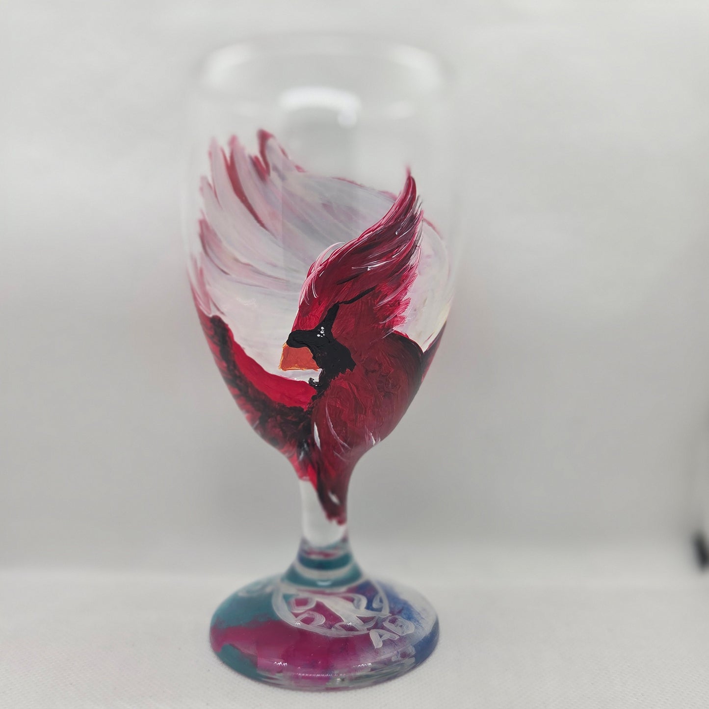 Hand-painted 16 oz goblet with a dramatic red male cardinal and enormous wings spreading up and around the glass