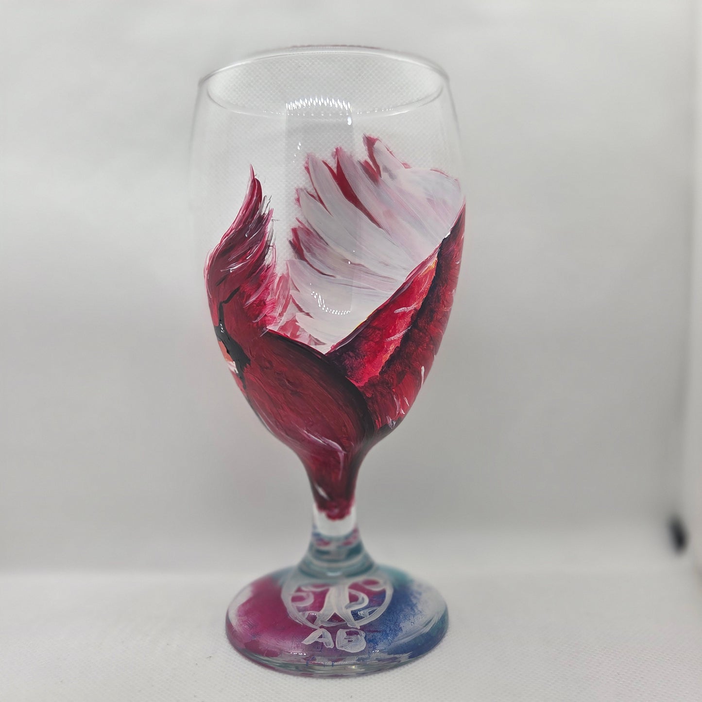 Hand-painted 16 oz goblet with a dramatic red male cardinal and enormous wings spreading up and around the glass