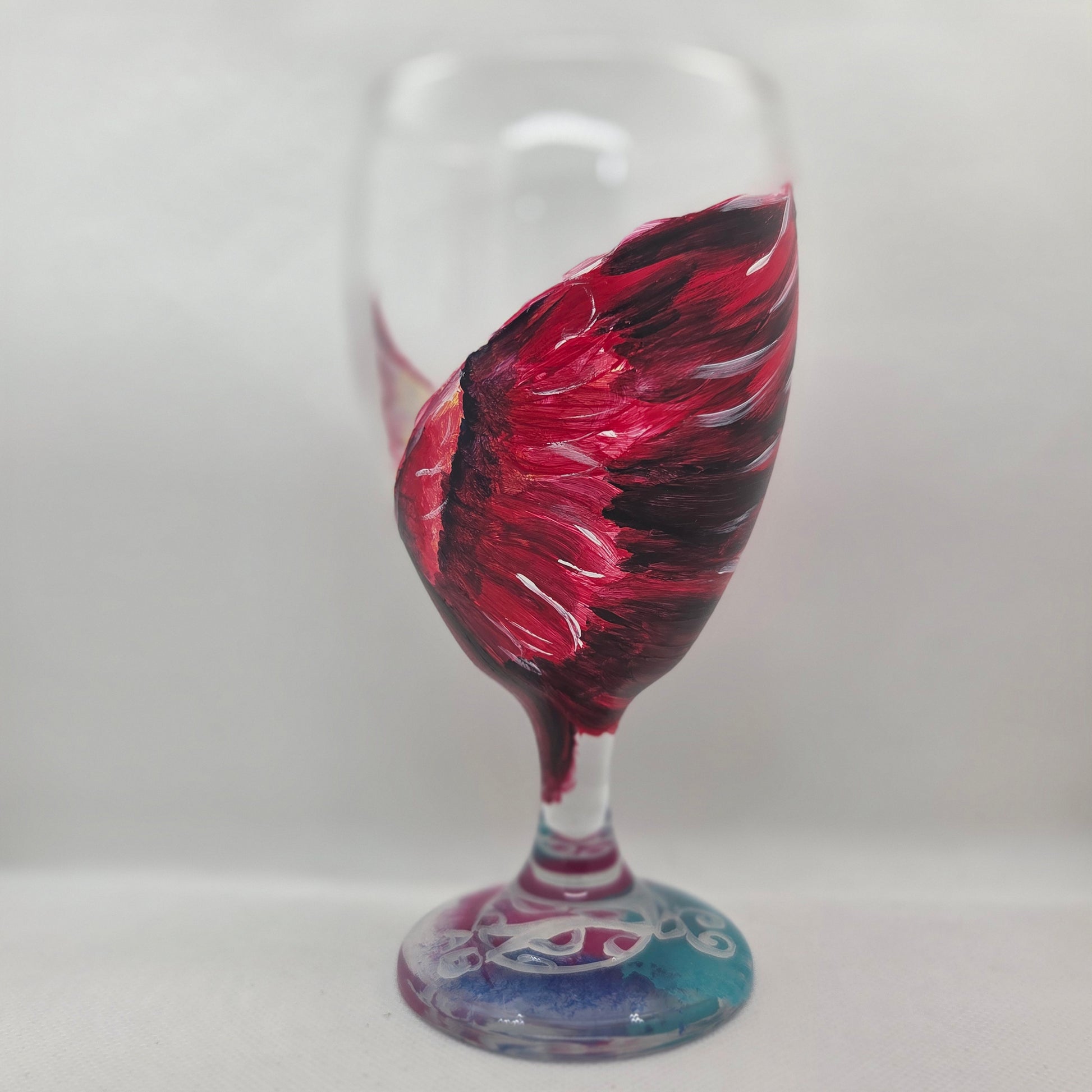 Hand-painted 16 oz goblet with a dramatic red male cardinal and enormous wings spreading up and around the glass