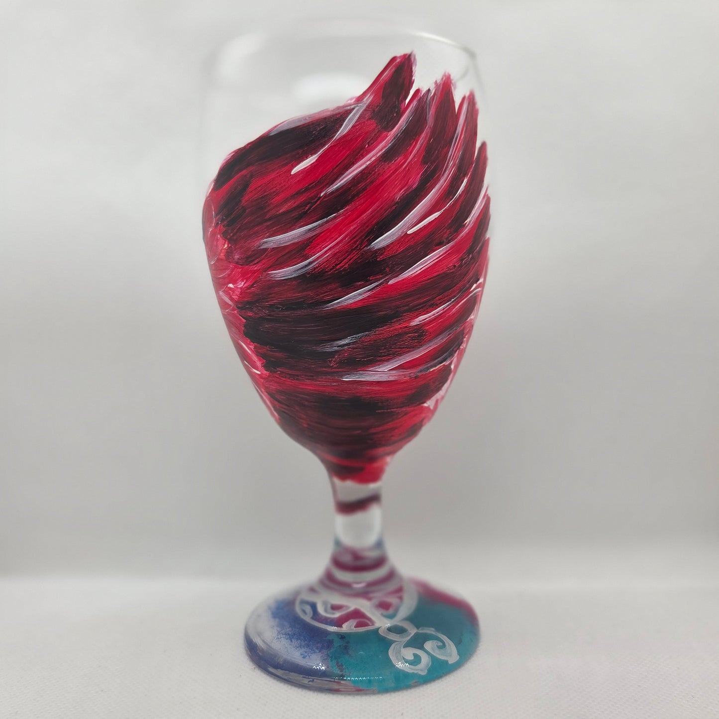Hand-painted 16 oz goblet with a dramatic red male cardinal and enormous wings spreading up and around the glass