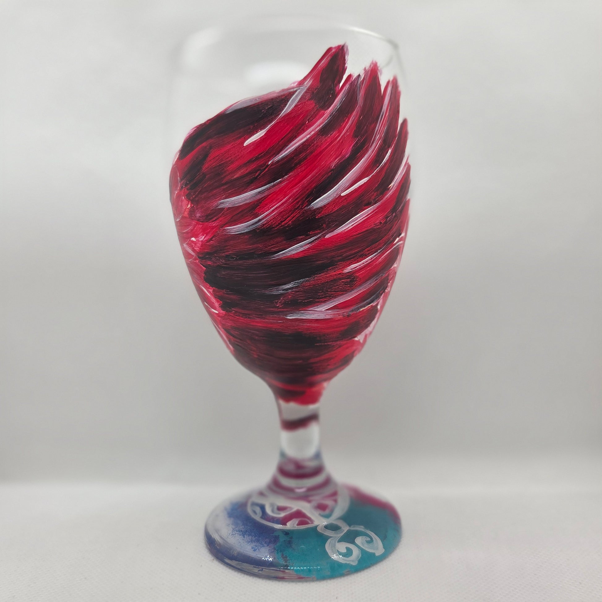 Hand-painted 16 oz goblet with a dramatic red male cardinal and enormous wings spreading up and around the glass