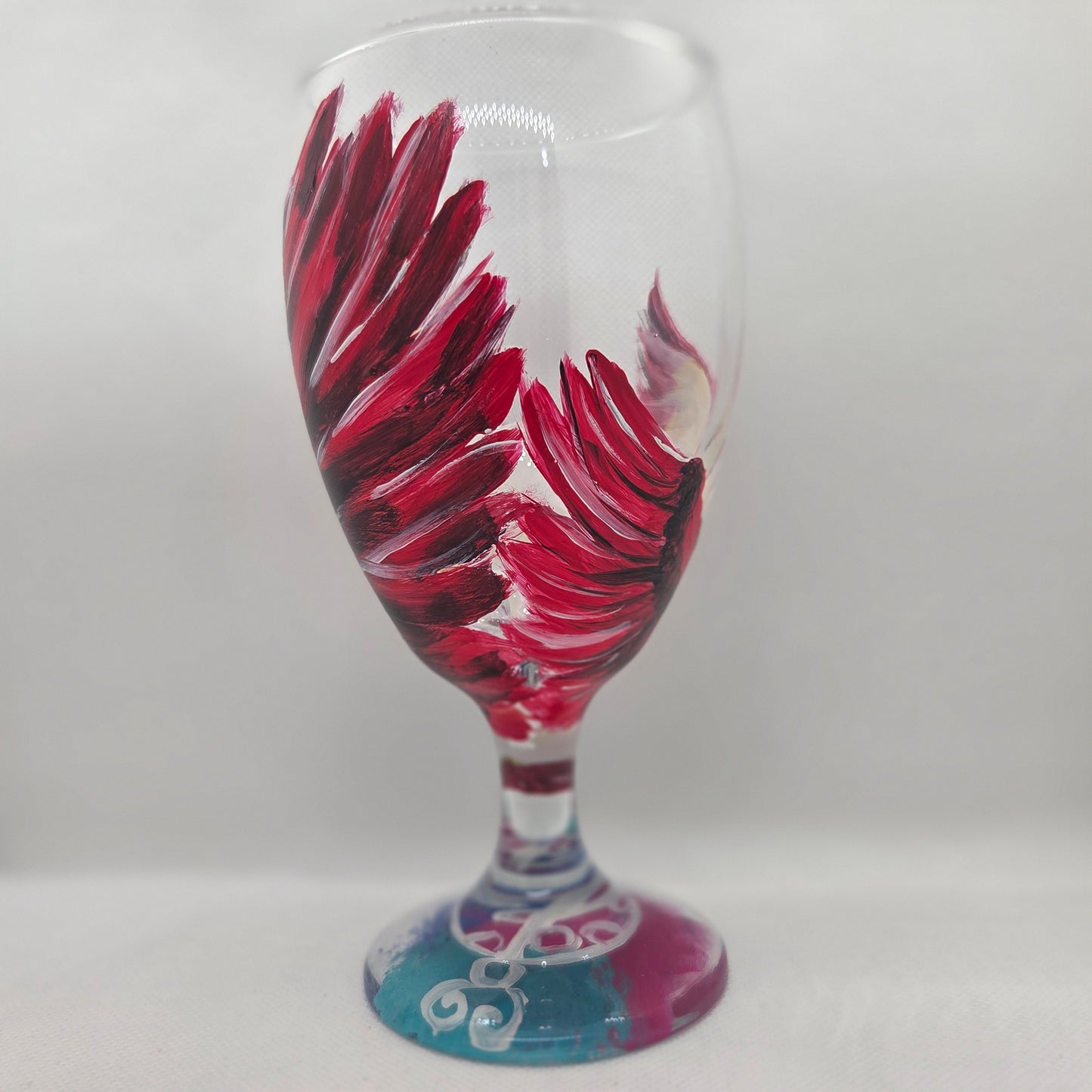 Hand-painted 16 oz goblet with a dramatic red male cardinal and enormous wings spreading up and around the glass