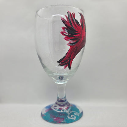 Hand-painted 16 oz goblet featuring a complete red cardinal in flight with bold black and white details