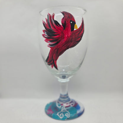 Hand-painted 16 oz goblet featuring a complete red cardinal in flight with bold black and white details