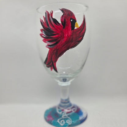 Hand-painted 16 oz goblet featuring a complete red cardinal in flight with bold black and white details