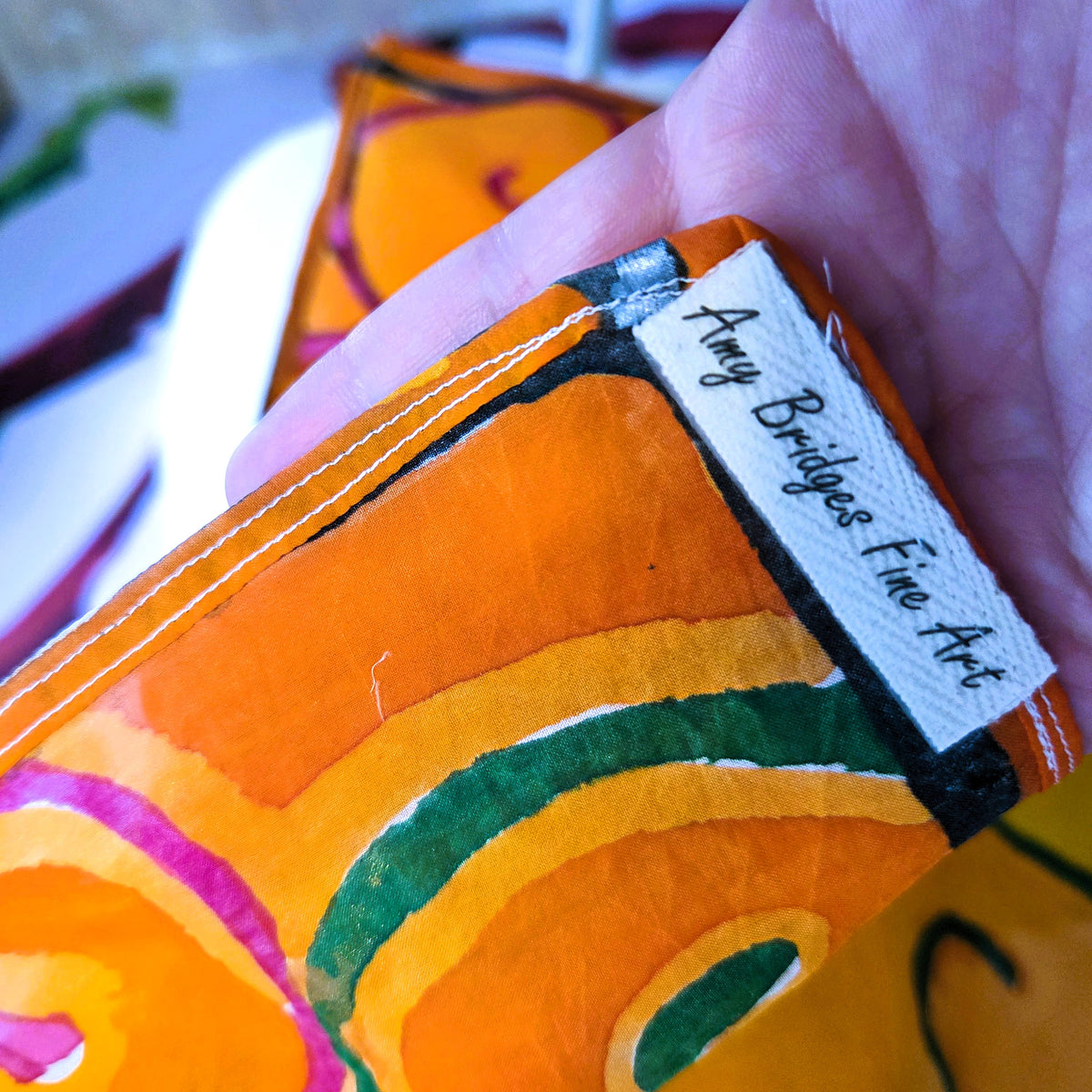 Autumn Gate hand-painted habotai silk scarf with pink and green wrought iron inspired linework