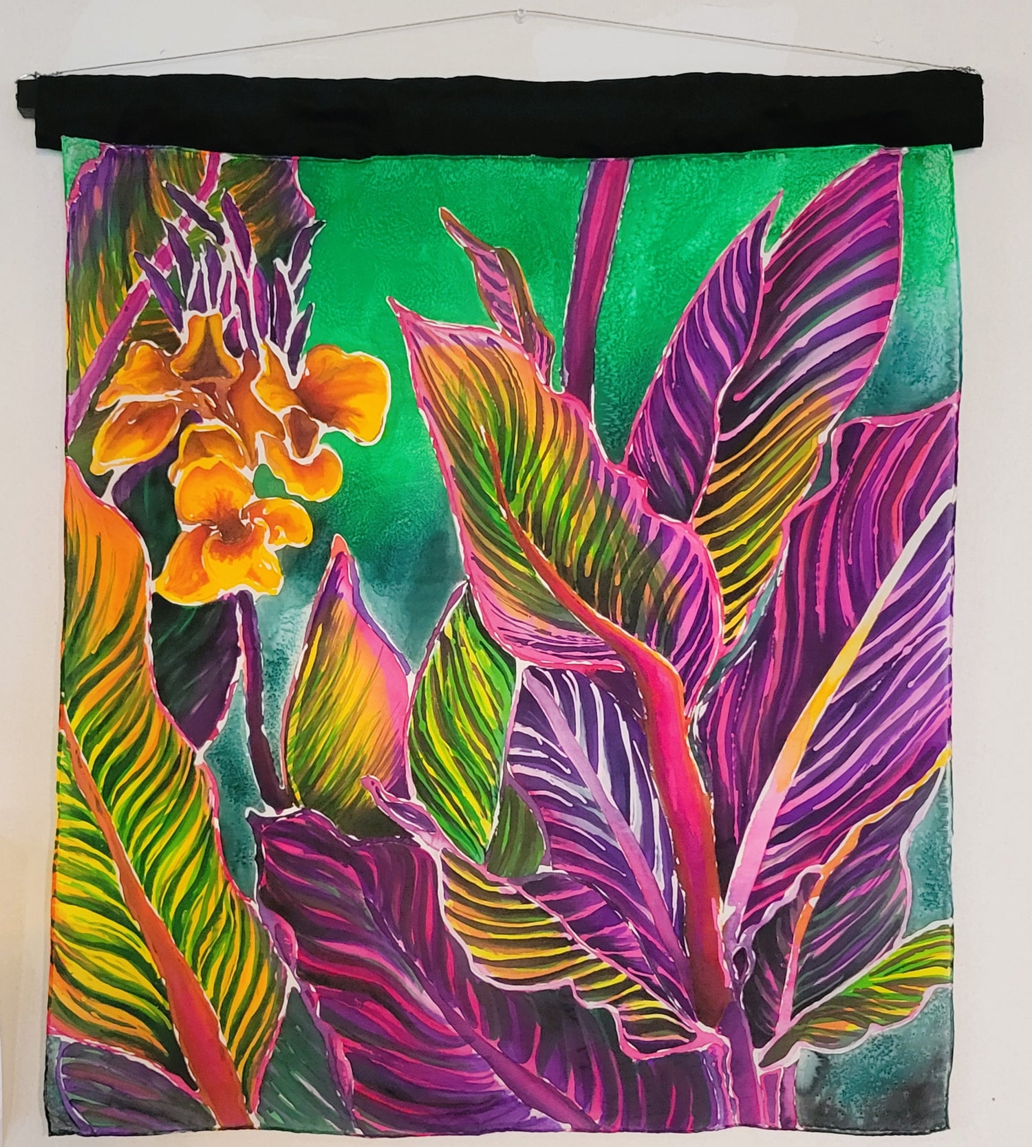 Original hand-painted silk artwork titled Rainbow Lilies featuring colorful canna lily leaves with rainbow veining by Amy Bridges
