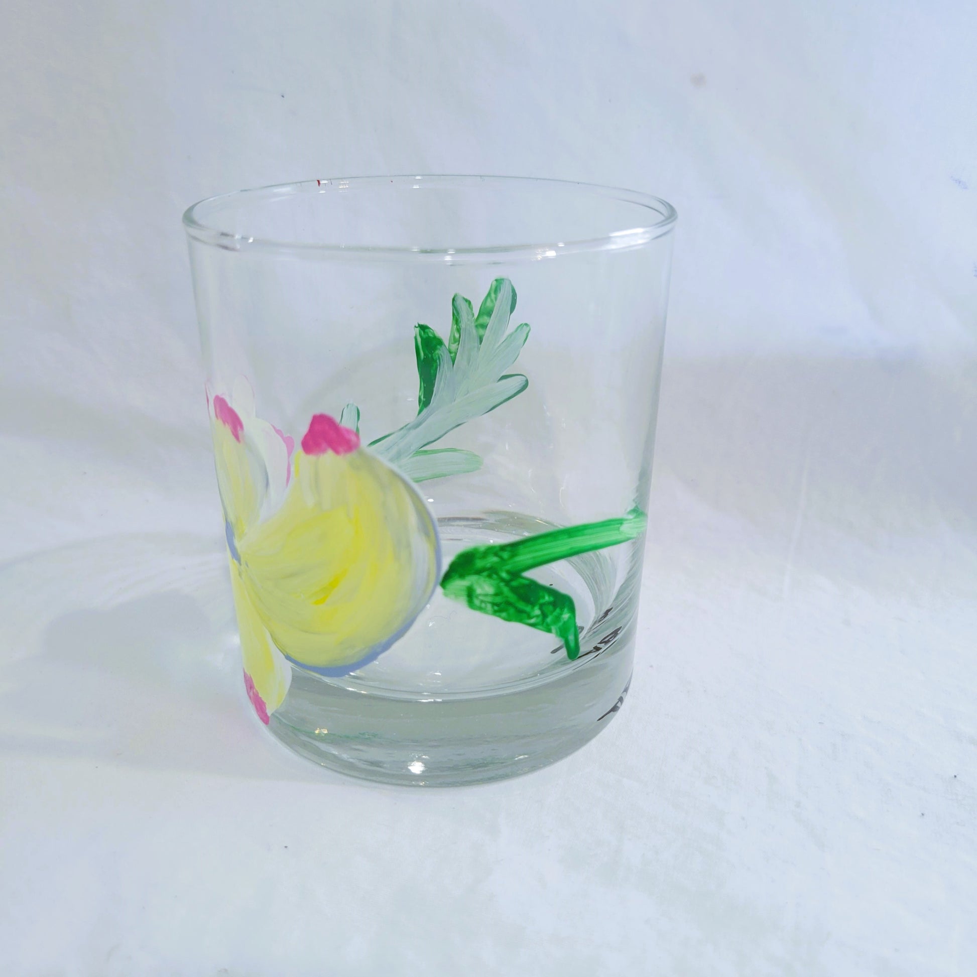 yellow dogwood blossom and stem side view highball glass