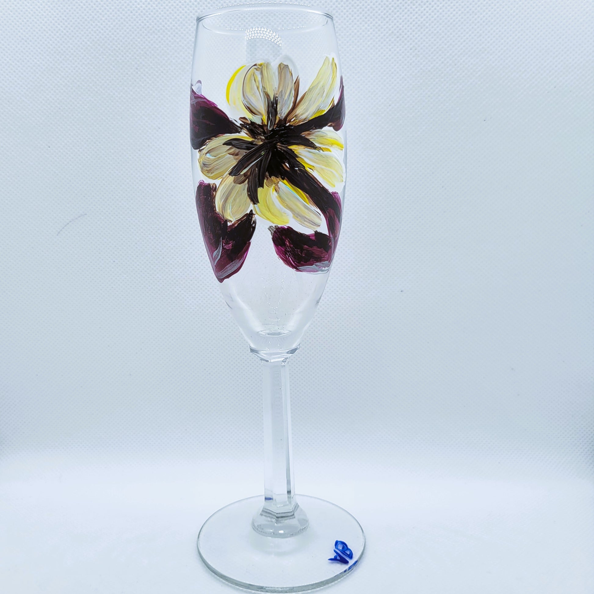 purple and cream flower champagne flute